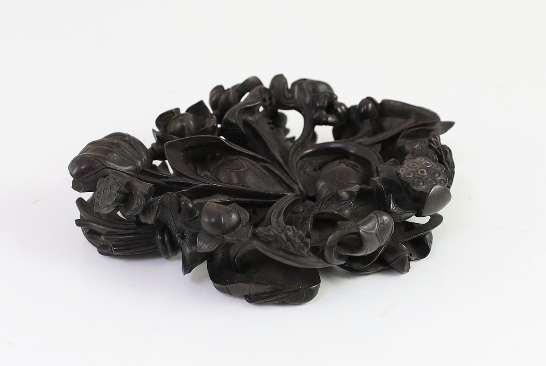 A fine Chinese carved zitan ‘lotus’ stand, Qing dynasty, 14.5cm long, small losses